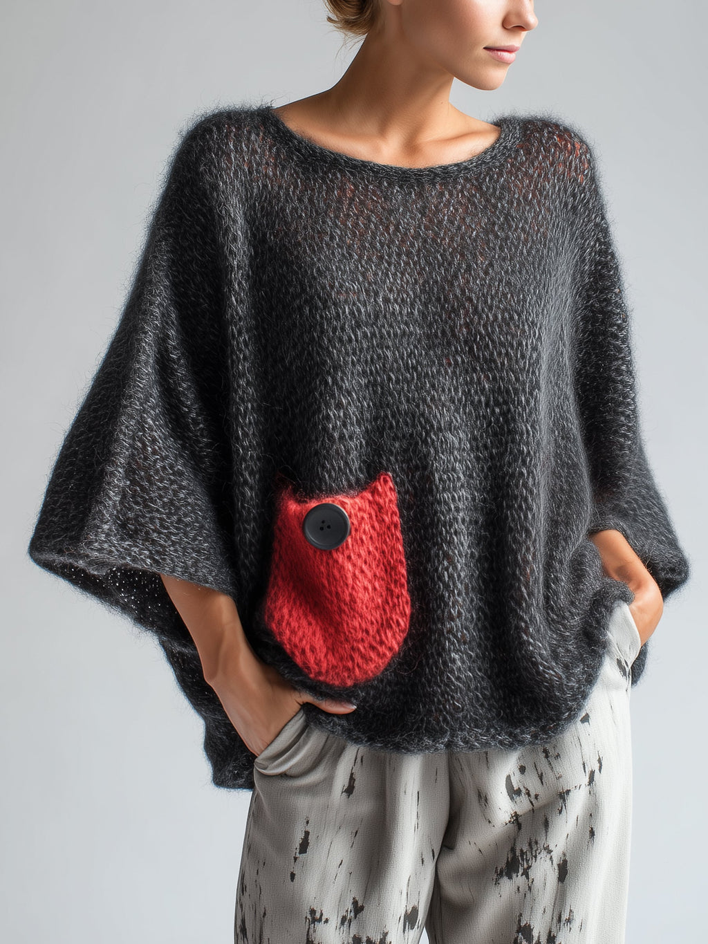 Black oversized mohair blend batwing sweater with red contrast pocket