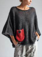 Black oversized mohair blend batwing sweater with red contrast pocket