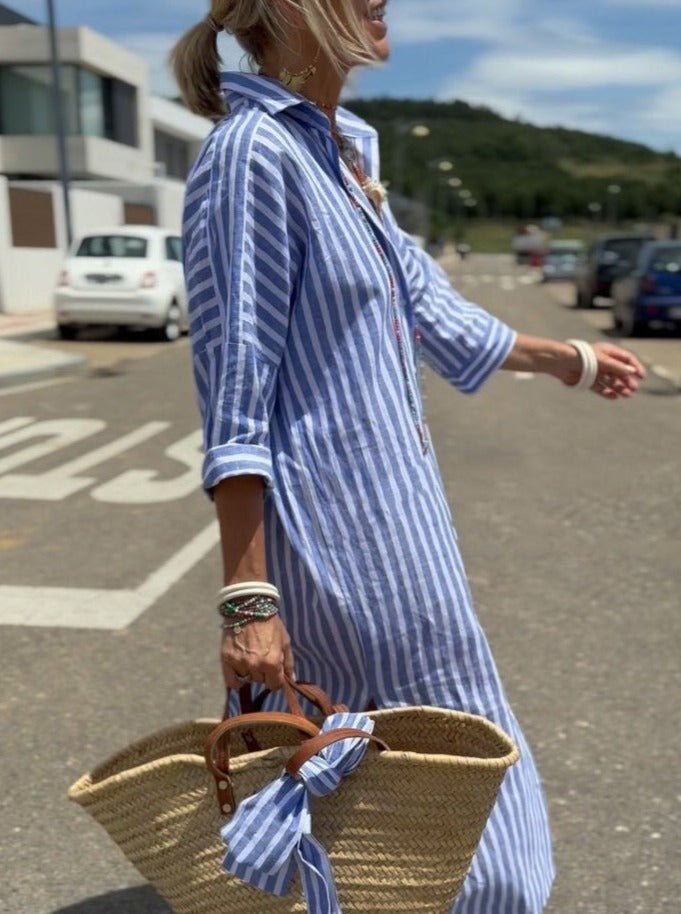 Side view of womens striped button front shirt dress