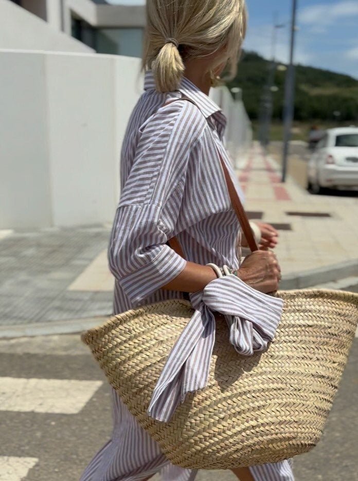 Button front and collar detail of striped shirt dress