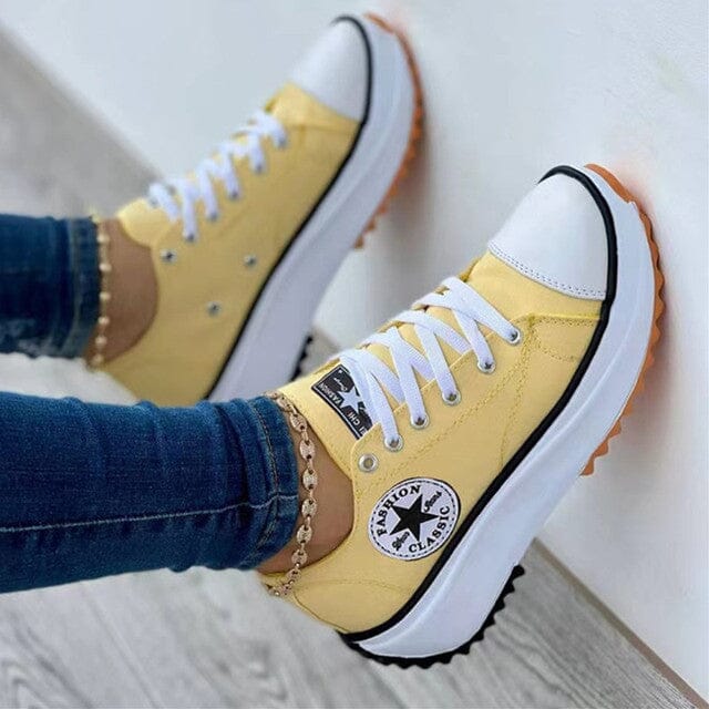 Back view of breathable womens sneakers in a neutral color