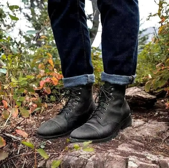 Black ankle boots for men showing rubber sole and clean silhouette