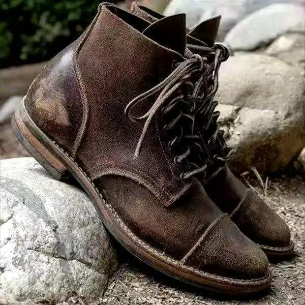 Close up of mens black ankle boot upper and stitching