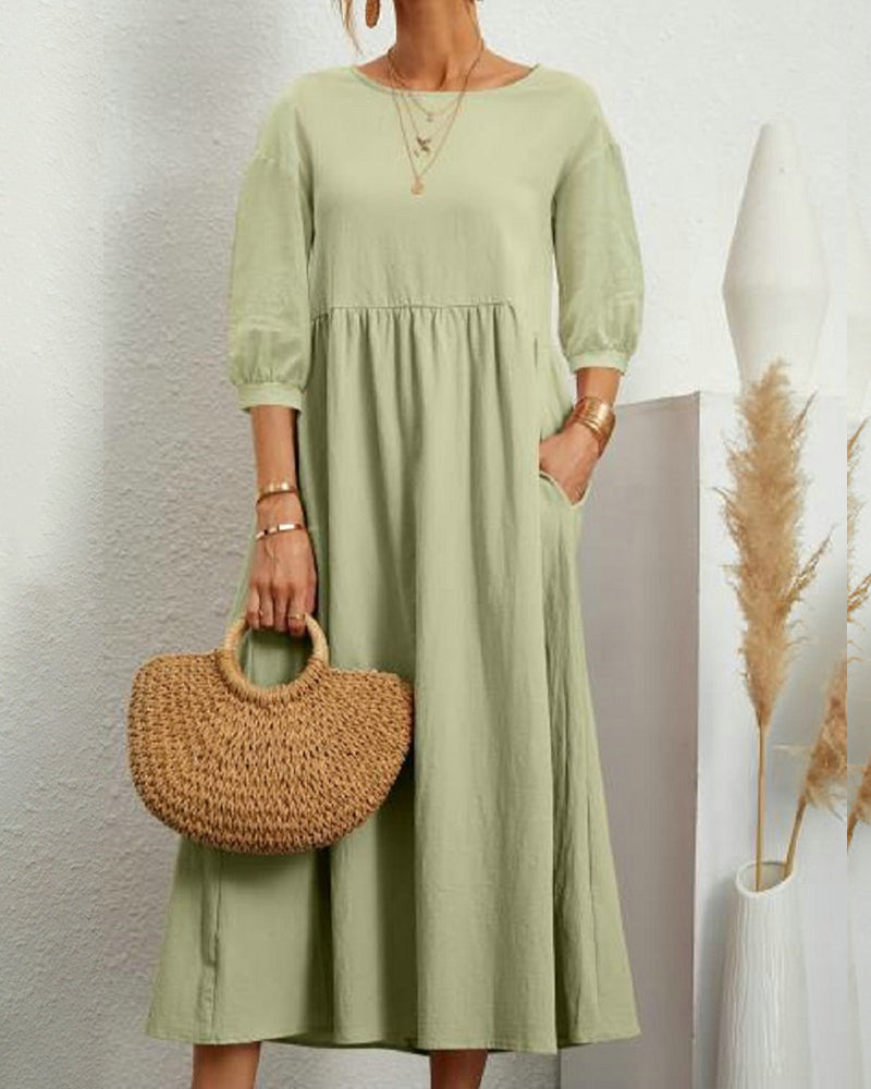 Lantern sleeve midi dress paired with heels