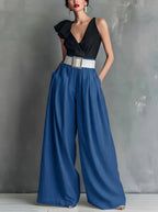 High waisted wide leg trousers worn with a tucked top, summer outfit