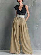 Back view of womens wide leg pants in a solid color