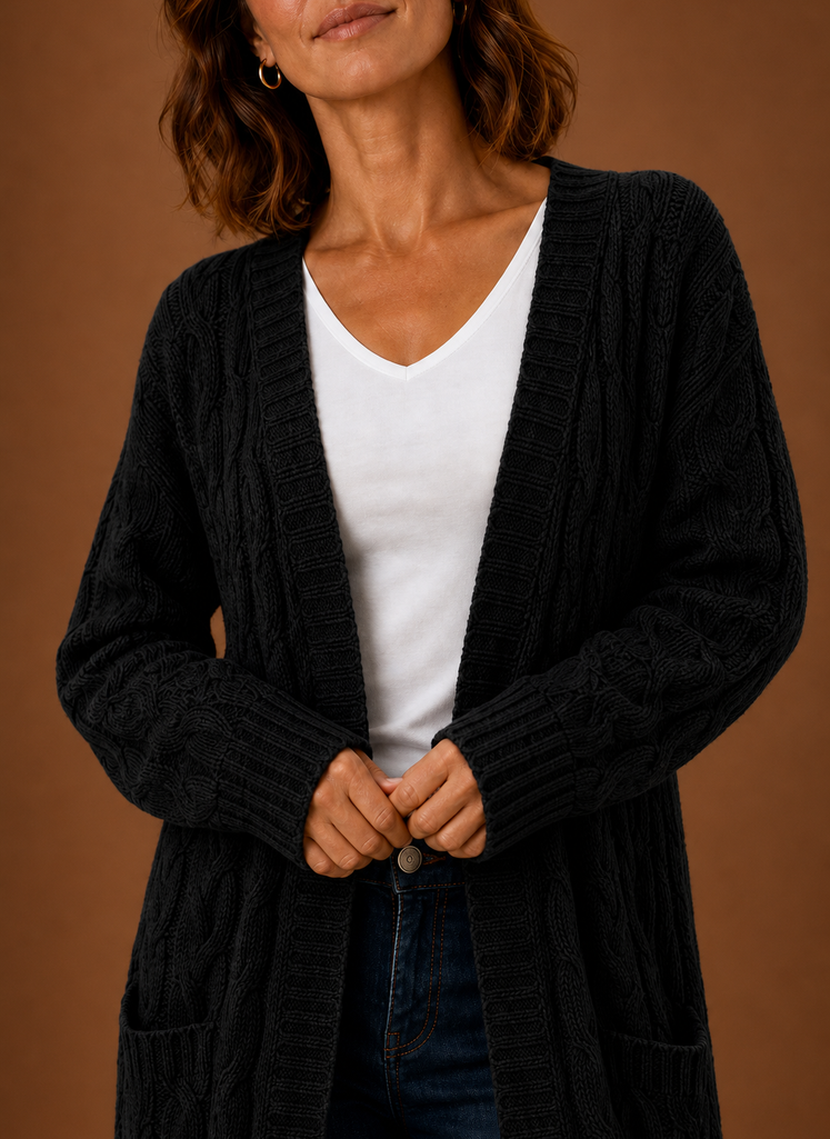 Black cable knit cardigan texture close up