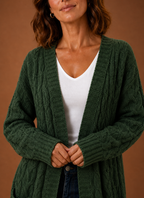 Green cable knit cardigan texture close up