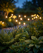 Solar firefly garden lights glowing at dusk, lifestyle