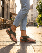 Women's orthotic sandals worn on sidewalk, lifestyle