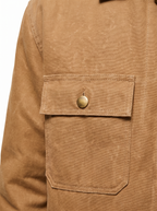 Barn jacket waxed canvas texture and patch pocket close up