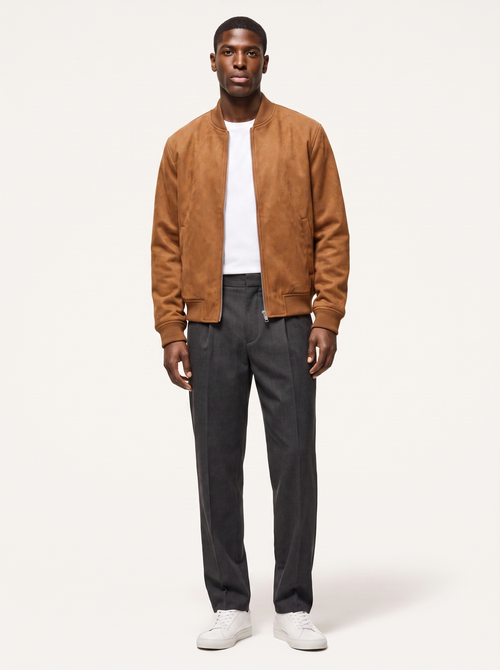 Cognac suede bomber jacket with ribbed collar worn by model, front view on white