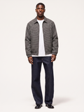 Black and white micro plaid harrington jacket worn by model, front view on white
