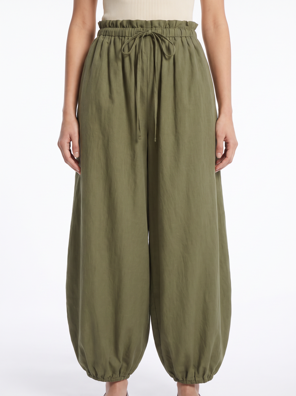 Balloon pants gathered high waistband and tapered leg close up detail