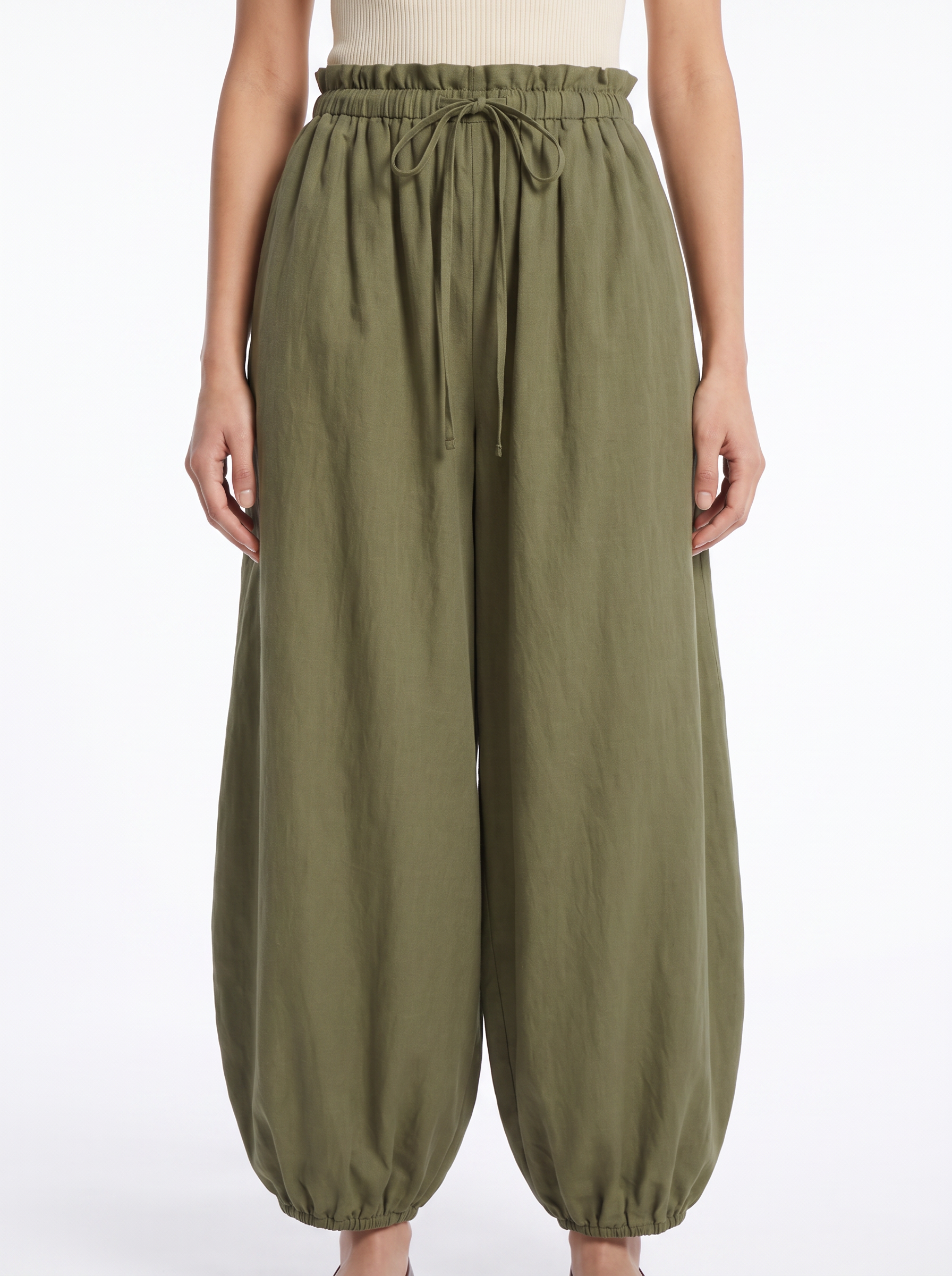 Balloon pants gathered high waistband and tapered leg close up detail