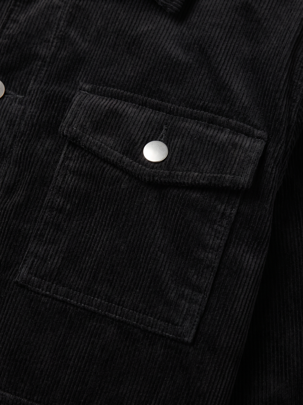 Corduroy cargo jacket flap pocket and wale texture close up detail