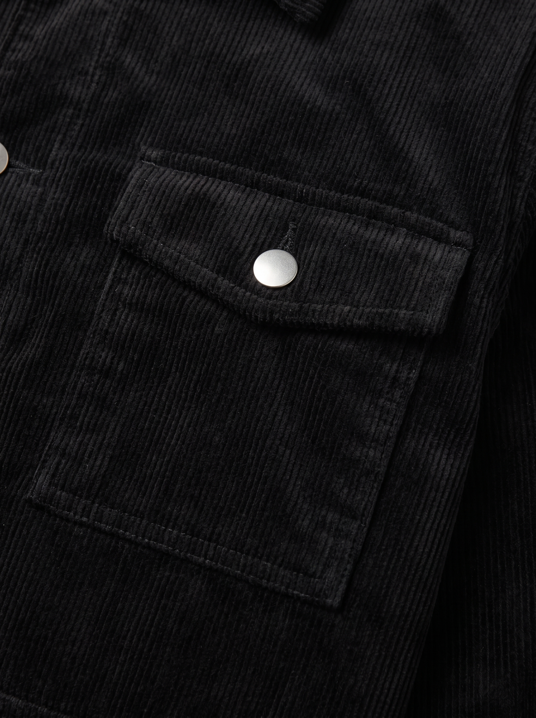 Corduroy cargo jacket flap pocket and wale texture close up detail