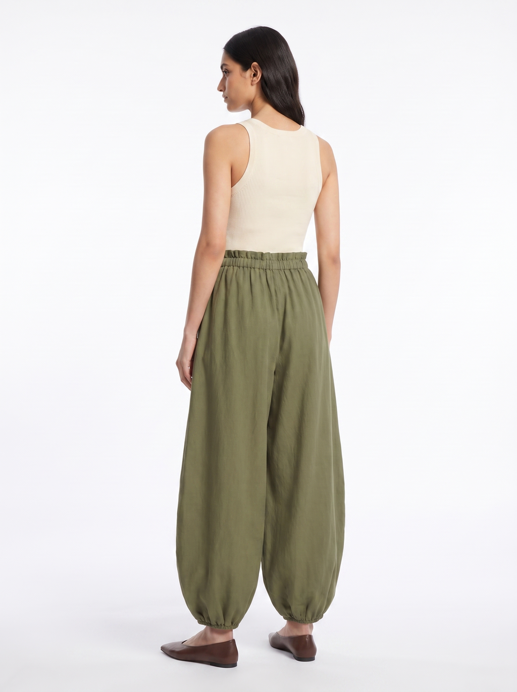 Olive balloon pants silhouette from rear three quarter angle