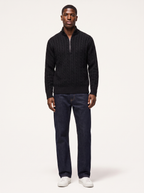 Knit quarter zip pullover sweater worn by model, front view on white