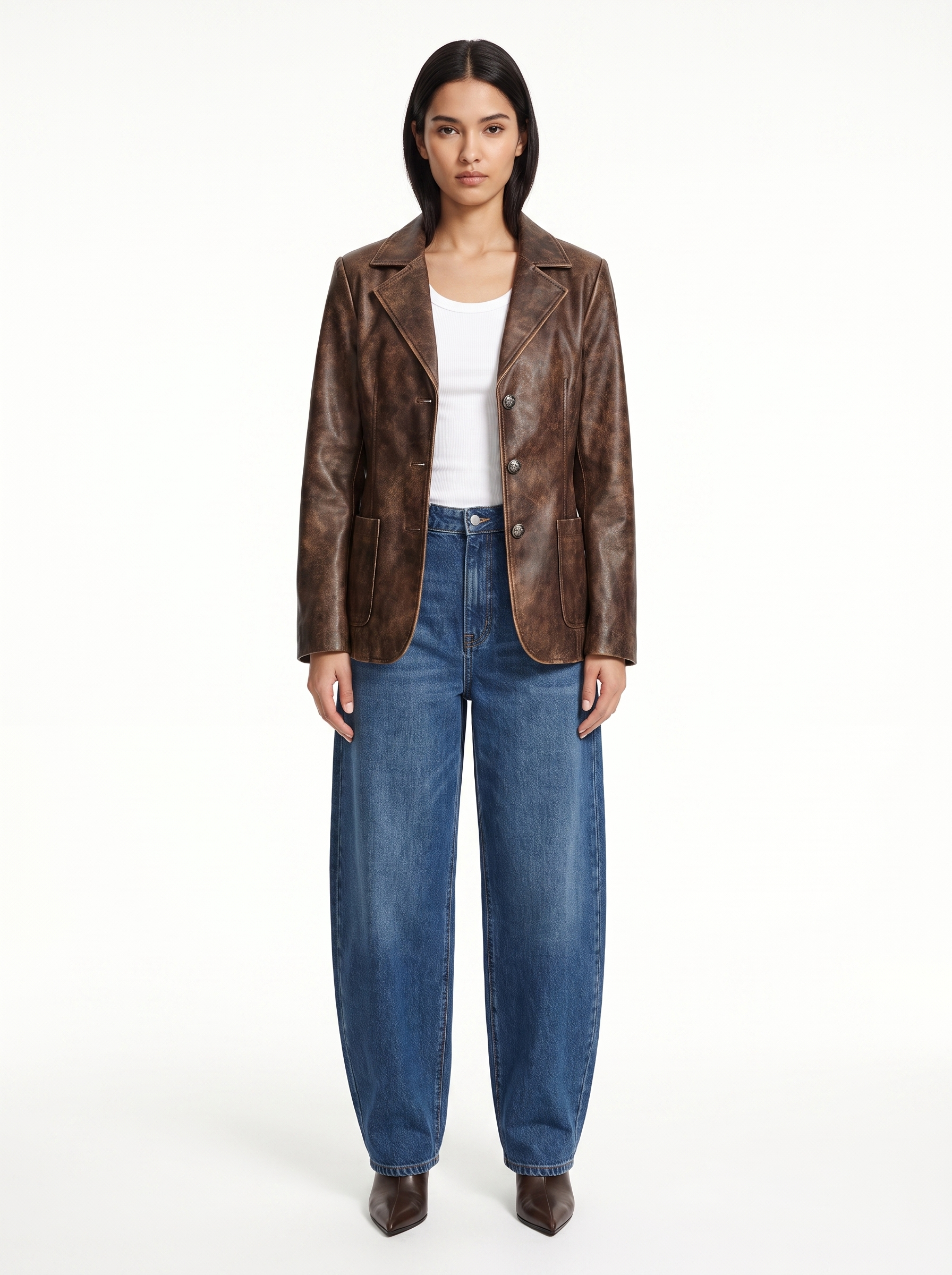 Vintage washed brown faux leather blazer worn by model, front view on white