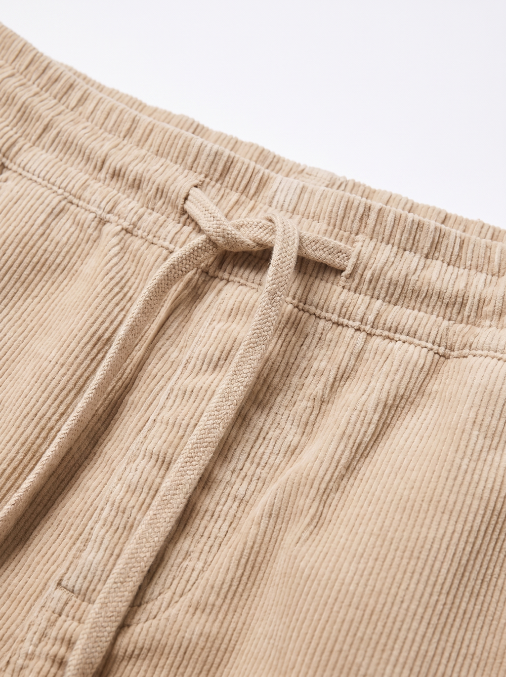 Corduroy pants drawstring waistband and texture close up detail