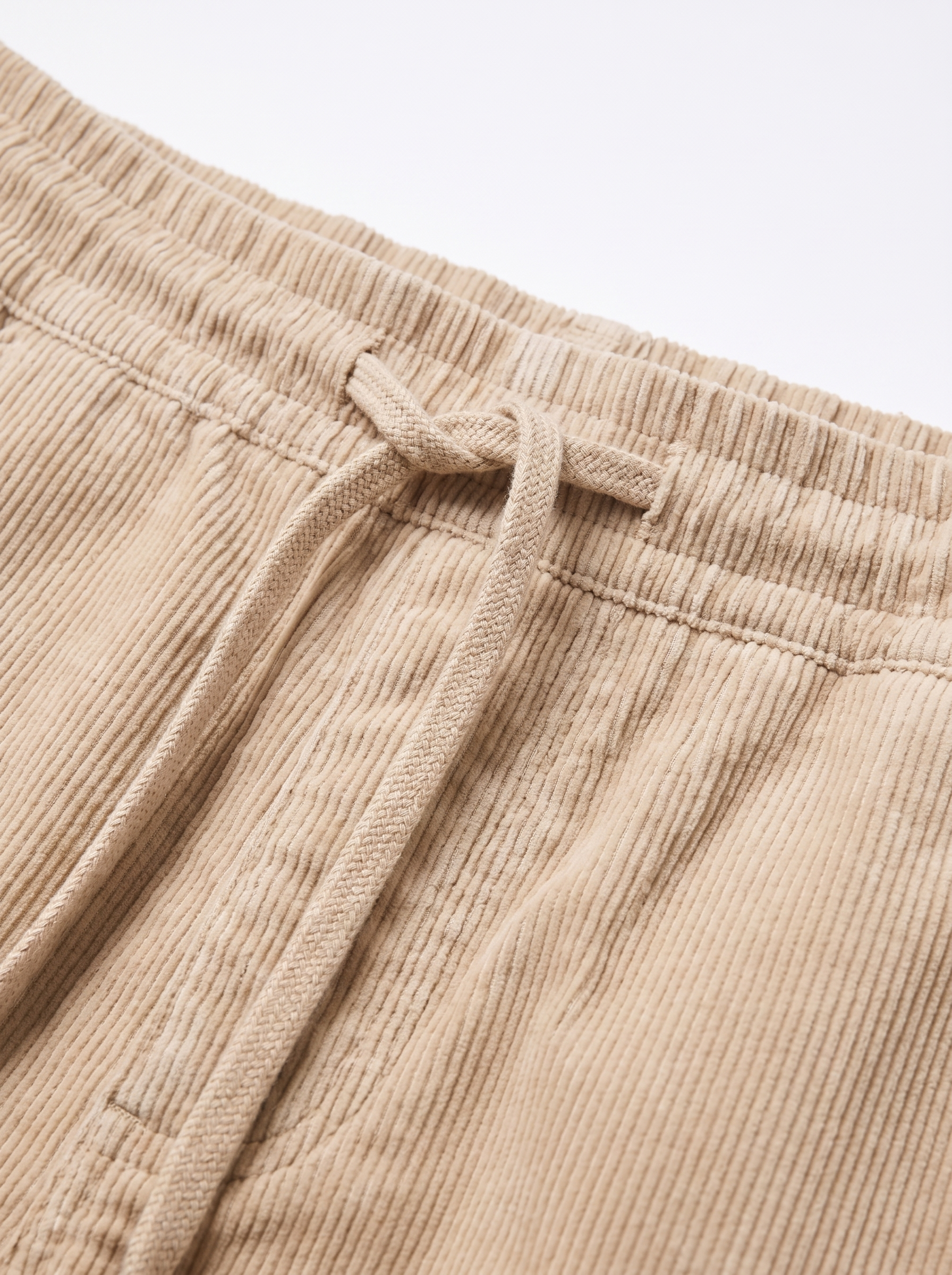 Corduroy pants drawstring waistband and texture close up detail
