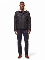 Black waxed canvas jacket with sherpa collar worn by model, front view on white