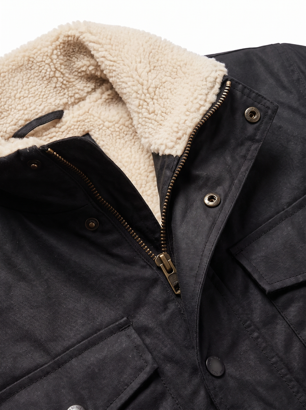 Sherpa collar and waxed canvas texture close up detail