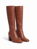 Pair of chestnut riding boots product shot on white background