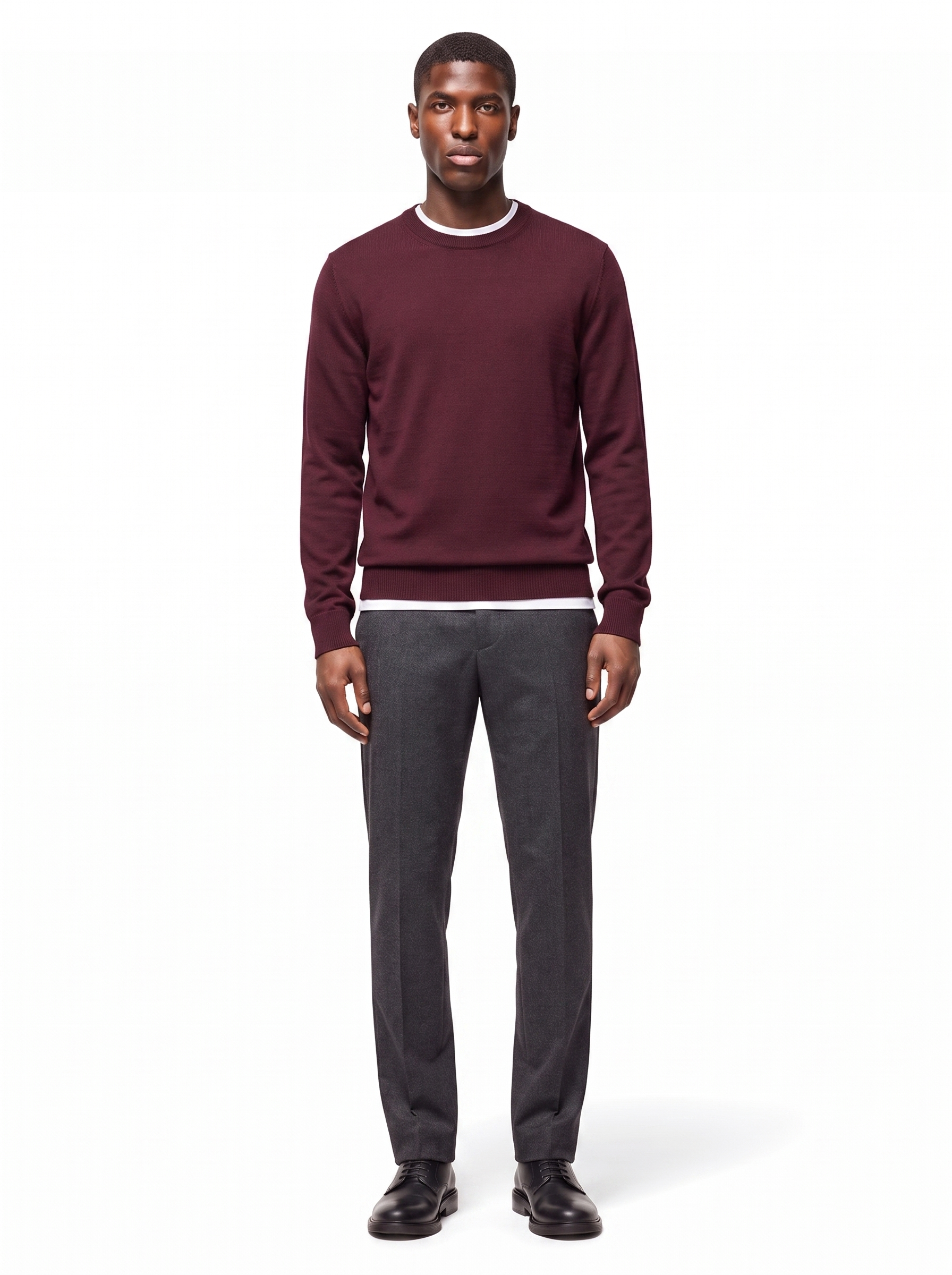 Deep burgundy crew neck sweater worn by model, front view on white