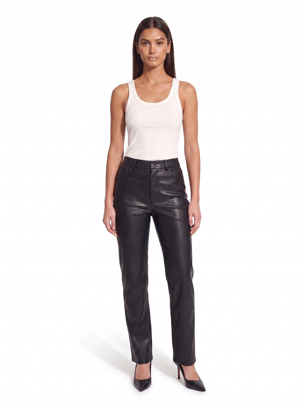 Black high waist faux leather pants worn by model, front view on white