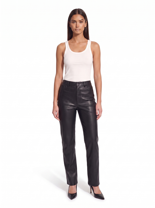 Black high waist faux leather pants worn by model, front view on white