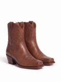 Pair of western ankle boots product shot on white background