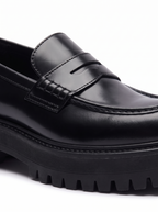 Penny strap and lug sole detail close up