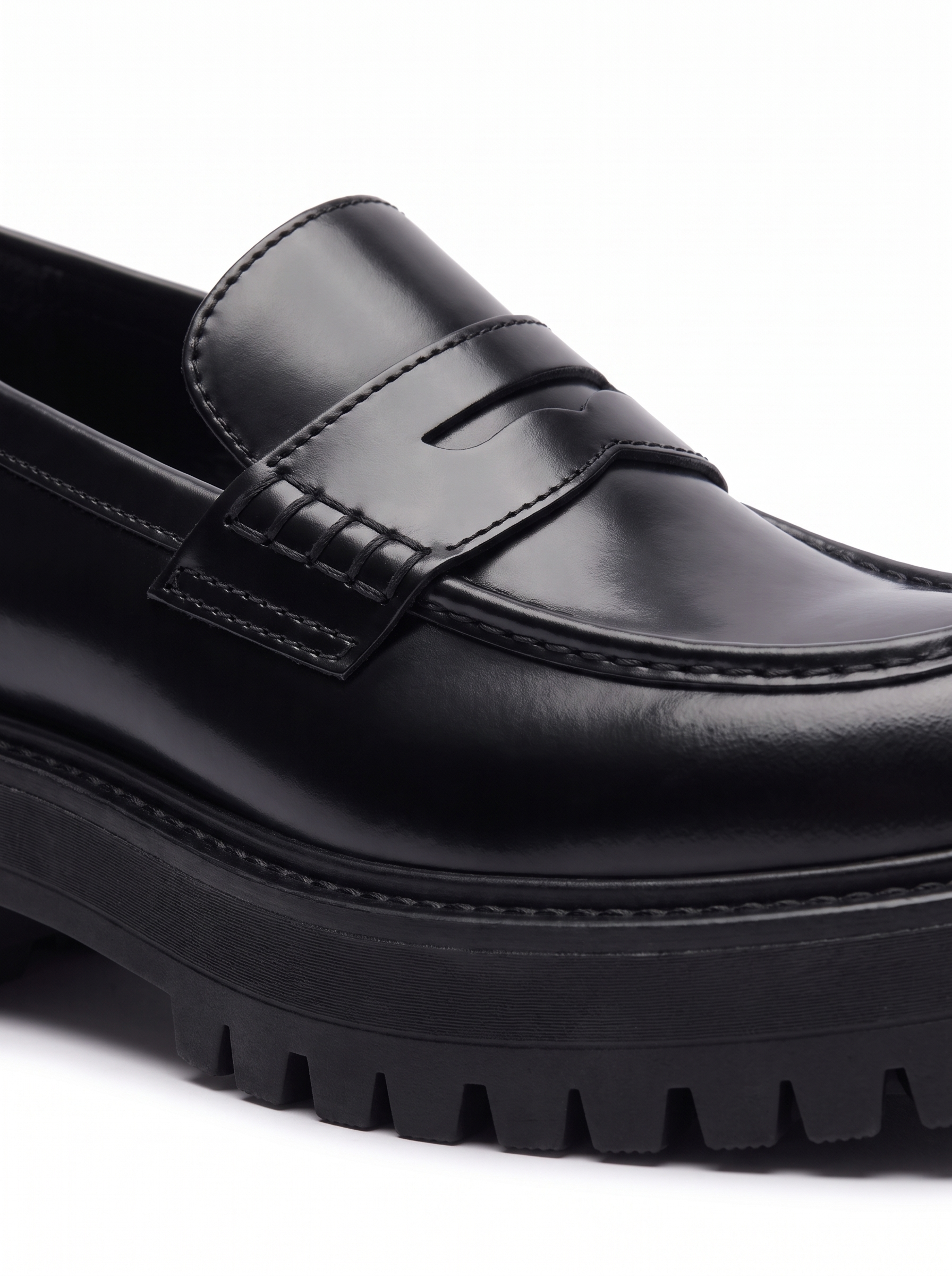 Penny strap and lug sole detail close up