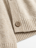 Matte button placket and ribbed hem close up detail
