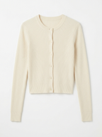 Cream ribbed knit cardigan, front view on white background