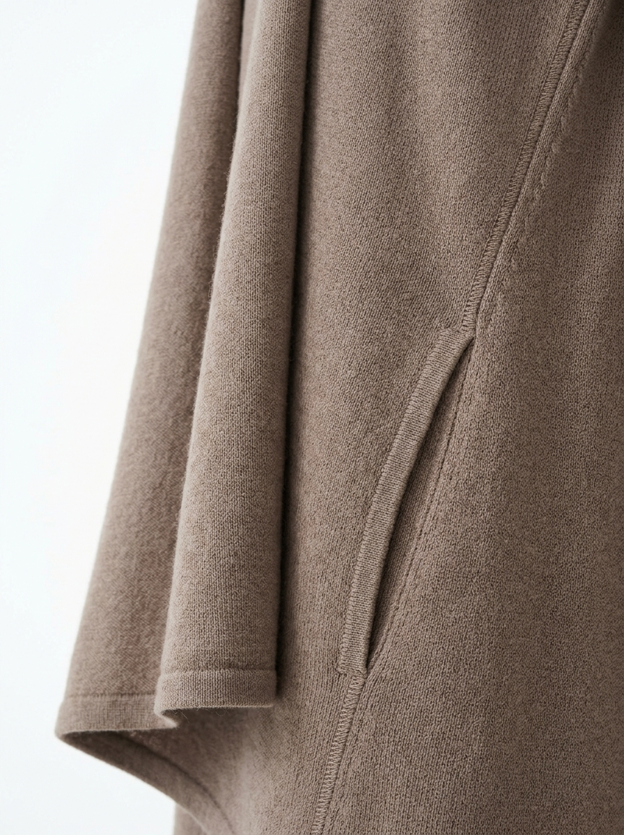 Draped front edge and welt pocket close up detail
