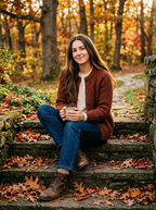 Woman wearing chestnut chunky cardigan with jeans in autumn