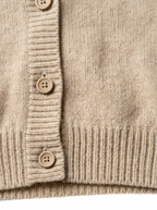 Button placket and ribbed hem close up detail
