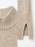 Ribbed collar and side slit hem close up detail