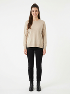 Oatmeal relaxed pullover worn by model, front view on white