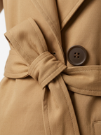 Belt knot and gabardine twill close up detail