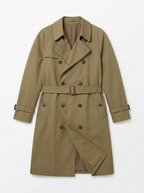 Khaki double breasted trench coat, front view on white background