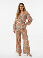 Multicolor paisley print pantsuit worn by model, front on white