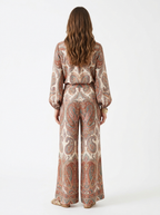 Multicolor paisley print pantsuit worn by model, back on white