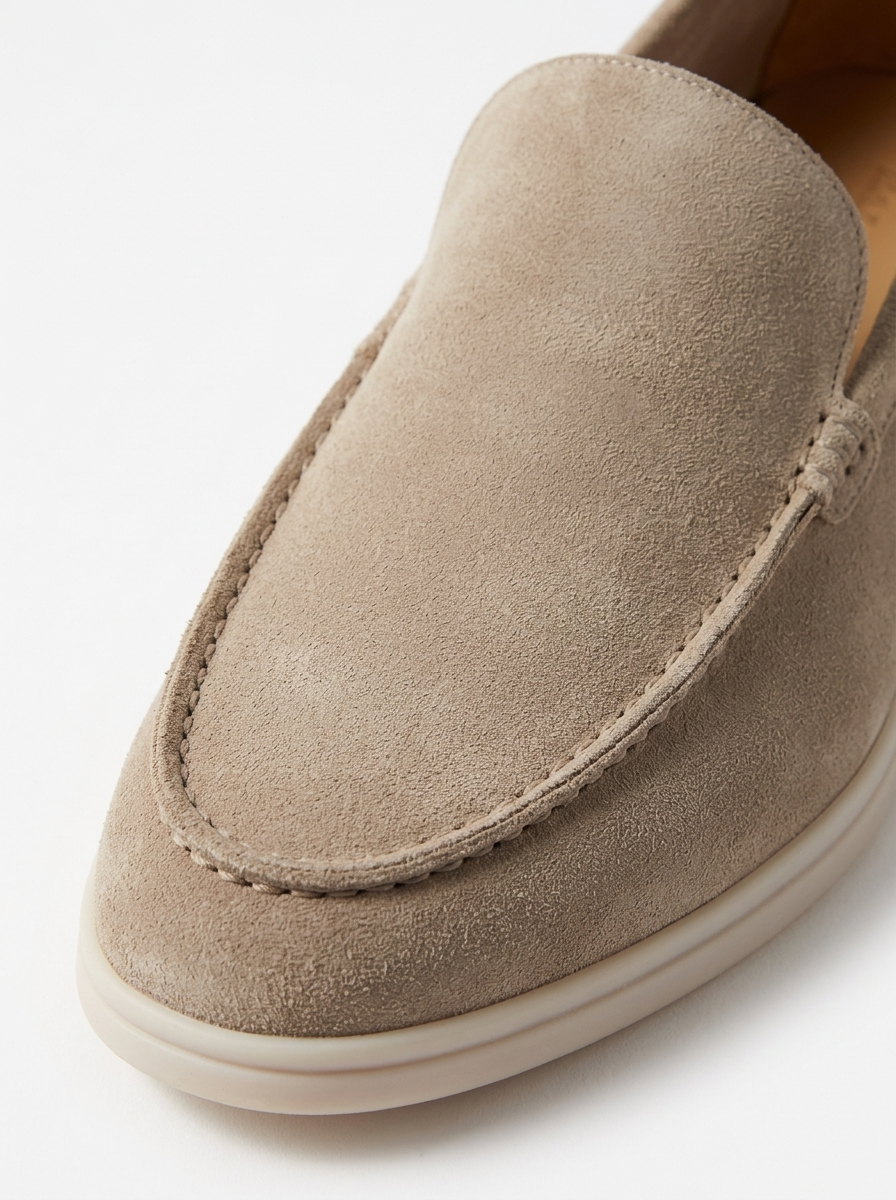 Moc-toe apron seam and suede detail close up